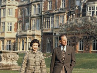 Queen Elizabeth II and Prince Philip are photographed on the Sandringham Estate in 1982.