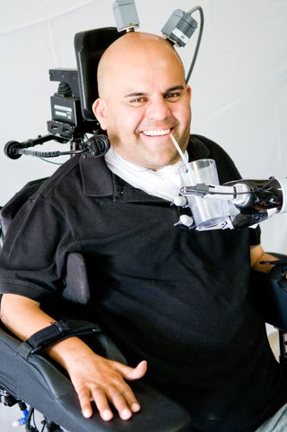Giving himself a drink for the first time in 10 years, Erik Sorto said, "The project has made a huge difference in my life. It gives me great pleasure to be part of the solution for improving paralyzed patients’ lives."