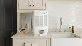 A Meaco dehumidifier on a kitchen counter