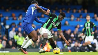 Brighton&#039;s Carlos Baleba shields the ball from Chelsea&#039;s Axel Disasi during the sides&#039; December 2023 Premier League encounter.