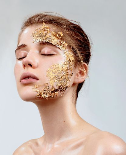 woman with gold foil on the side her face