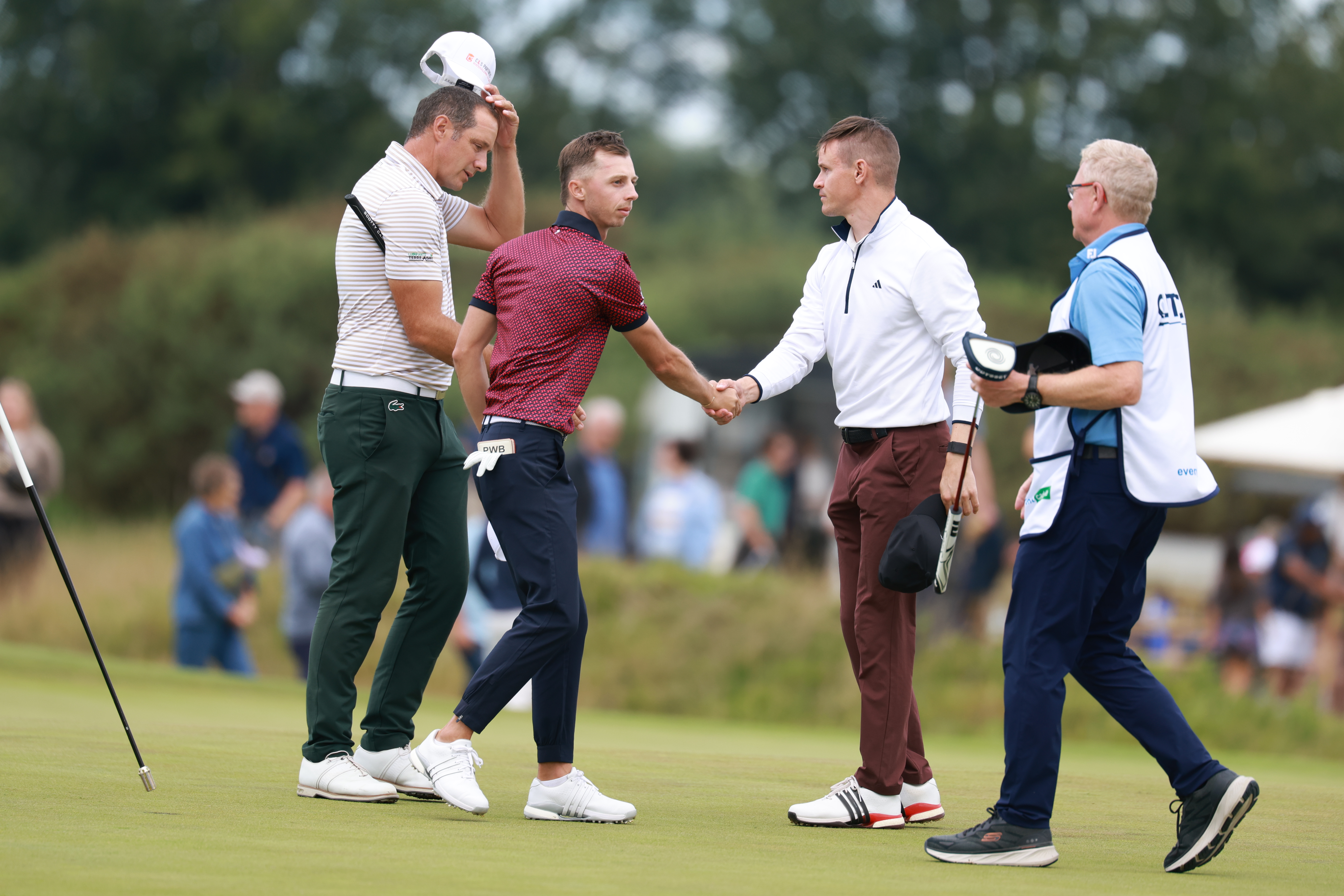 Piers Berrington shakes hands with his playing partners following a round on the Clutch Tour in 2025