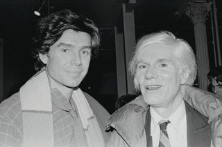 black and white image of two men standing next to each other