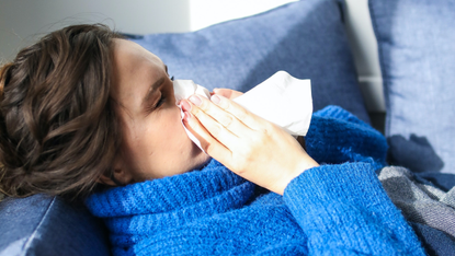 Woman sneezing