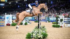 Serena Kullich riding Benfields Victory in the Yeti Under 25 British Showjumping Championship at the London International