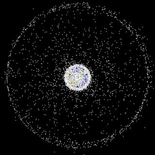 Space debris is a growing problem for machines and humans in space. This image shows large pieces of space debris orbiting the Earth (the size of the objects are enlarged). Even very small bits of space debris (micrometeoroids) can cause damage.