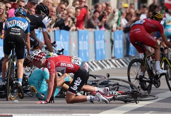Jurgen Van den Broeck gets onto his knees after crashing