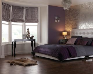 Purple bedroom with chenille roman blinds by English Blinds