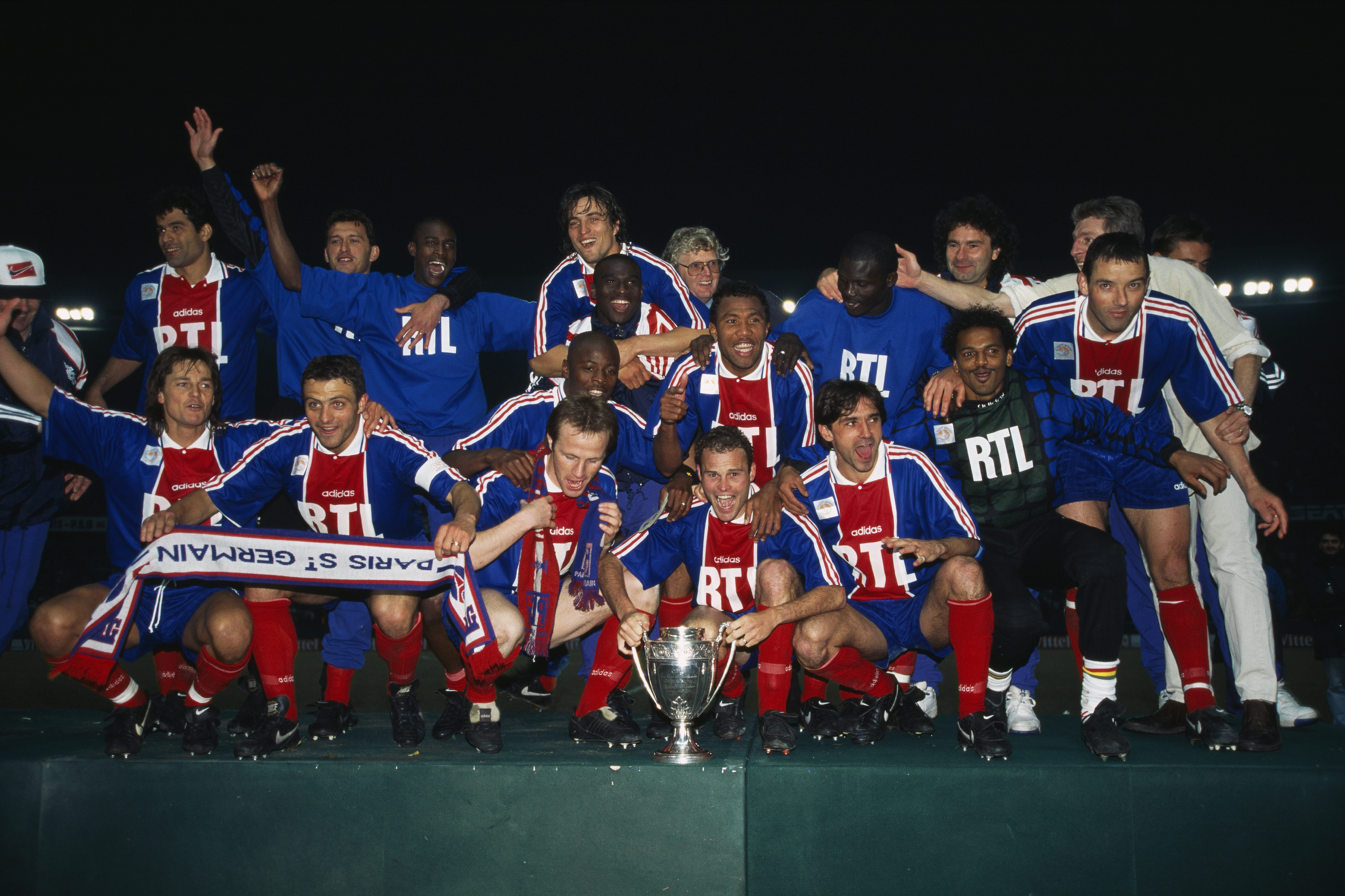 Paris Saint-Germain players celebrate victory over Strasbourg in the final of the 1995 Coupe de France.