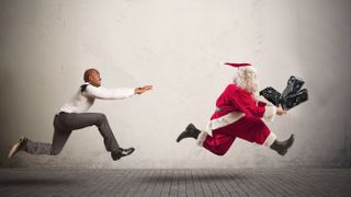 Man chasing Santa who's holding GPUs