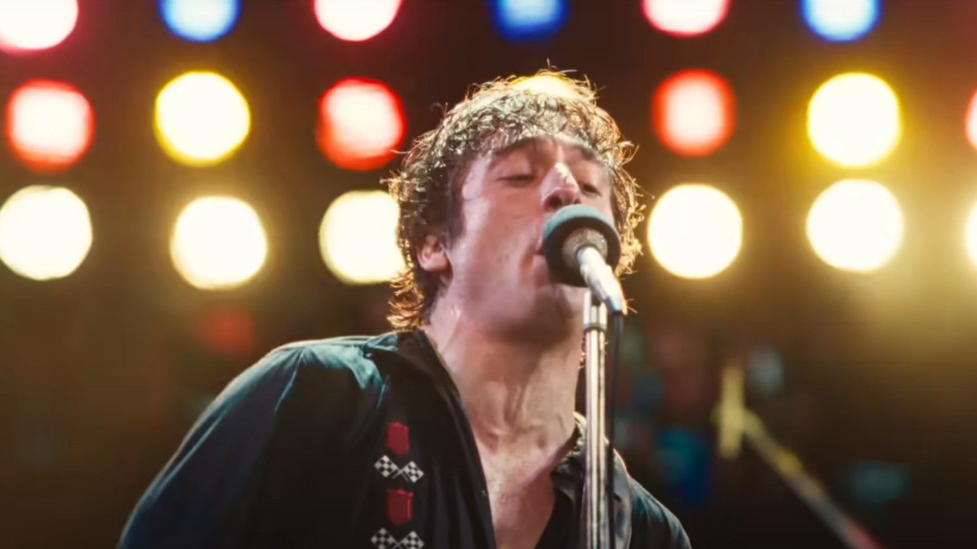 Jeremy Allen White singing into a microphone in Springsteen: Deliver Me from Nowhere