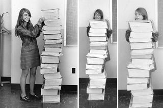 Computer scientist Margaret Hamilton poses for a series of photos with the Apollo guidance software she and her team developed at the MIT Instrumentation Laboratory.