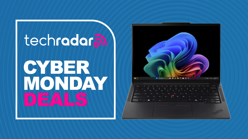 A Lenovo ThinkPad T14s on a blue background with a TechRadar badge reading &#039;Cyber Monday deals&#039;