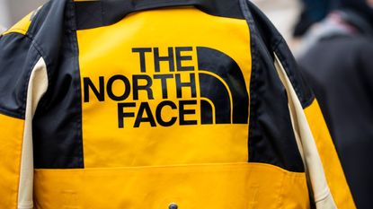 The North Face jacket details, is seen in the streets of Paris before the Acne Femme show on January 20, 2019 in Paris, France.