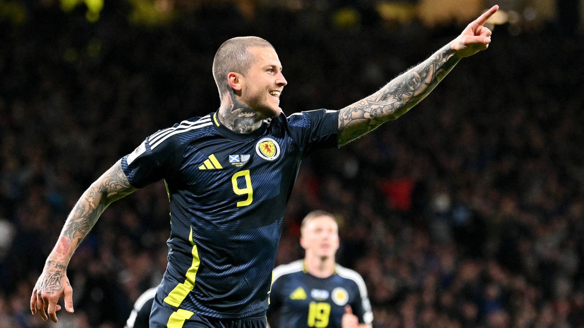 Lyndon Dykes celebrates scoring the team&#039;s third goale during the 2026 World Cup Group C qualifier football match between Scotland and Greece, at Hampden Park Stadium, in Glasgow, on October 9, 2025. 