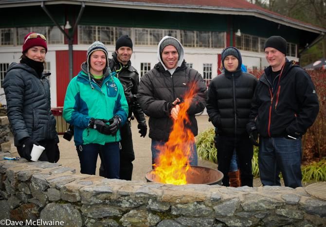 Spectators warming themselves