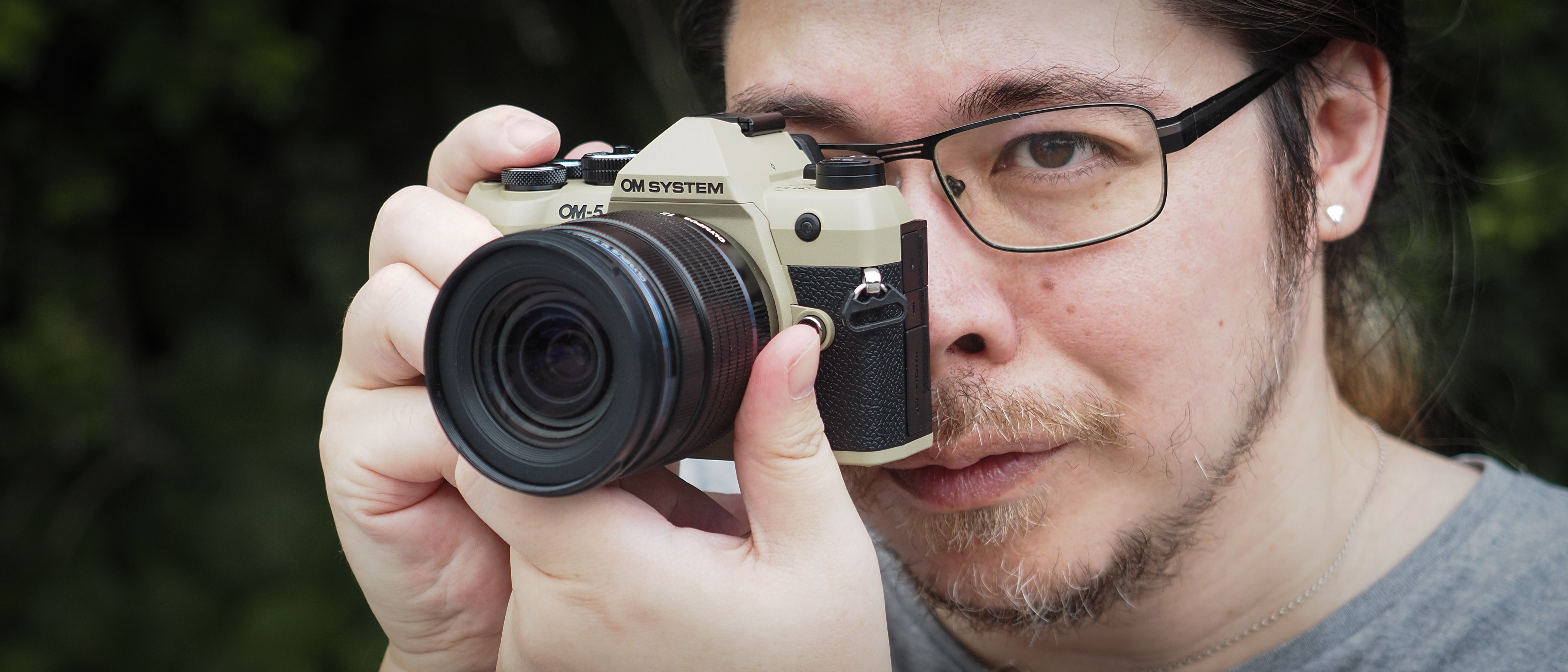 Photographer James Artaius using the OM System OM-5 Mark II