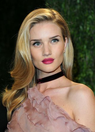 Actress Rosie Huntington-Whiteley arrives at the 2013 Vanity Fair Oscars Party