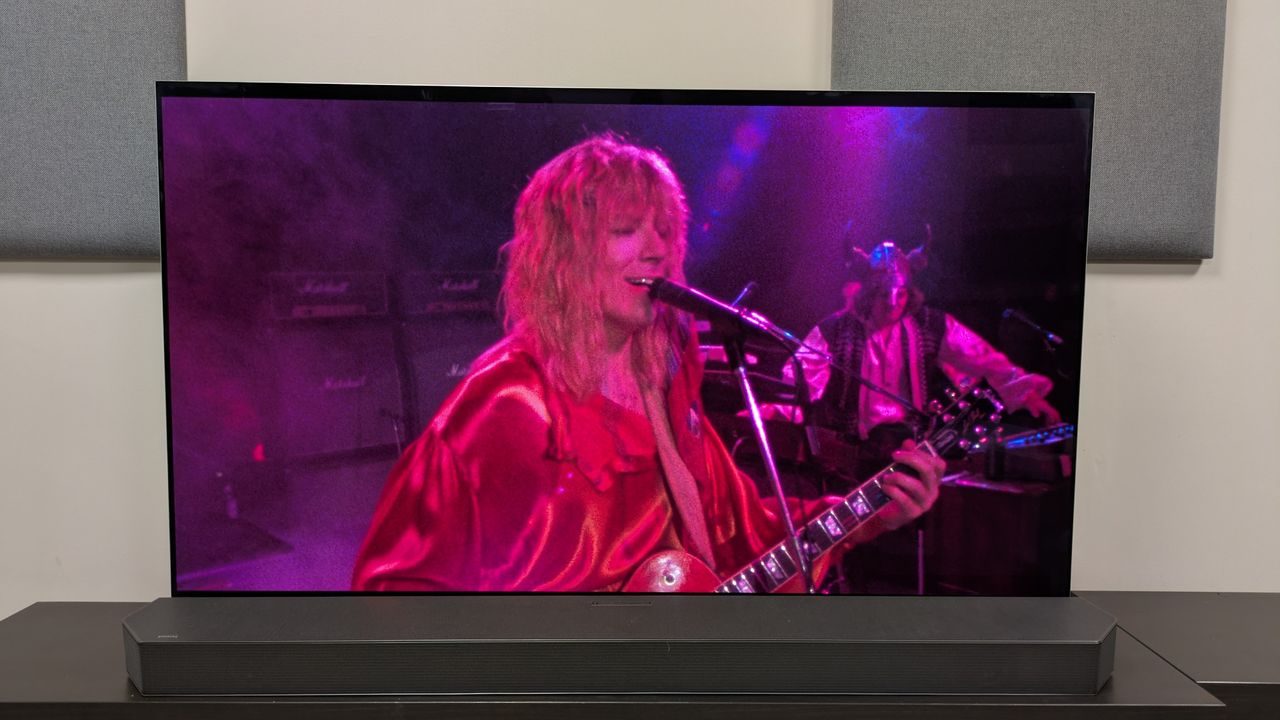 This is spinal tap 4k blu-ray on LG G5 showing David St Hubbins playing on stage. Demonstrates bold colors with the bright pink lighting