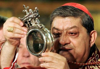 Cardinal Crescenzio Sepe holds the relic containing San Gennaro liquified blood
