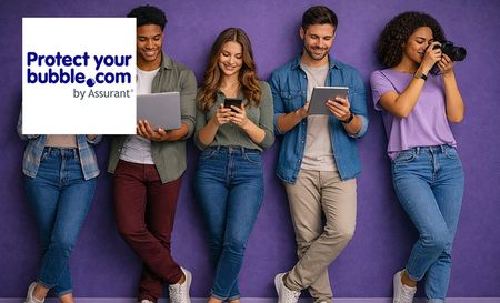 5 people holding some gadget standing in a line behind a purple backdrop