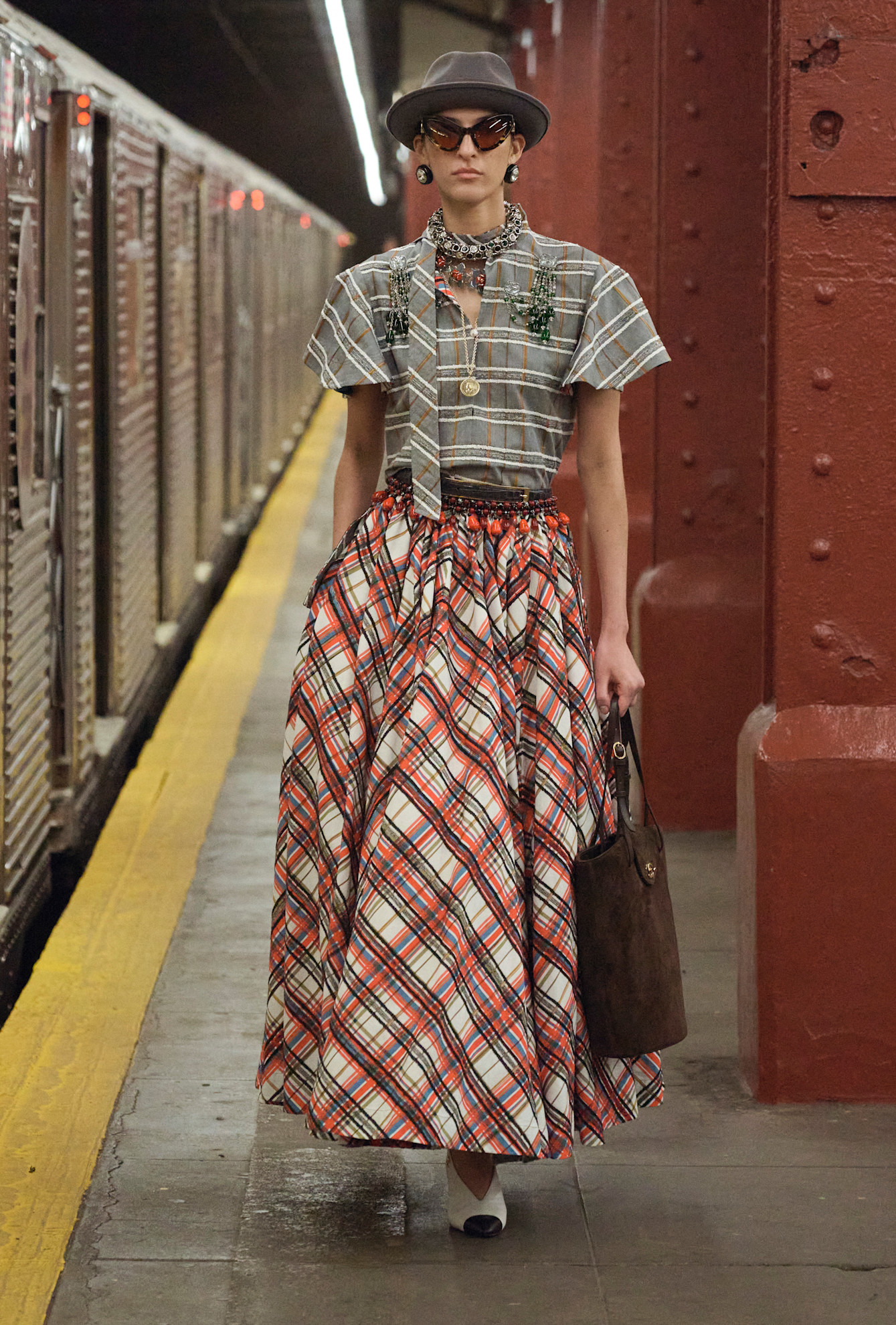 models walk the subway runway for the chanel metiers d'art 2026 show in new york city