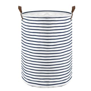 A navy blue and white striped laundry hamper