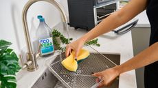 Header image of Christina Chrysostomou cleaning Cusinart Air Fryer Toaster Oven metal mesh basket