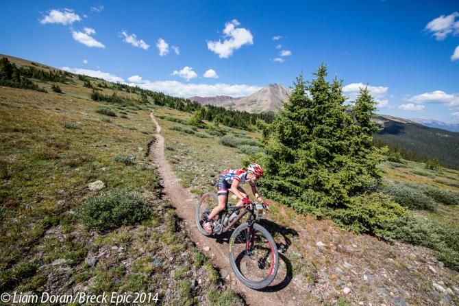 Catherine Williamson (Squirt Lube) descends with Mt Guyot in the background