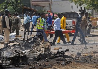 The aftermath of a suicide bomb in Mogadishu, Somalia