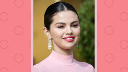 Selena Gomez smiling while wearing red lipstick and a pink turtleneck at the Premiere of Universal Pictures' "Dolittle" at Regency Village Theatre on January 11, 2020 in Westwood, California. on a red and pink background