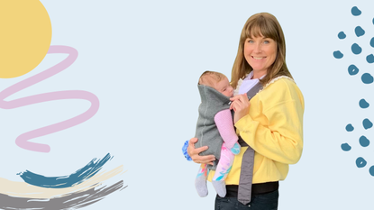 Image of Catherine Hudson holding her baby in a carrier on a canva background
