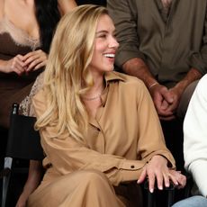 Scarlett Johansson wears a tan shirt