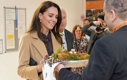 Kate opted for a cosy camel coat and polka dot dress 