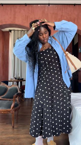 Influencer wears a polka dot dress.