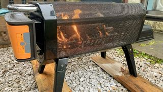 BioLite FirePit+ lit and being tested in writer's outside space