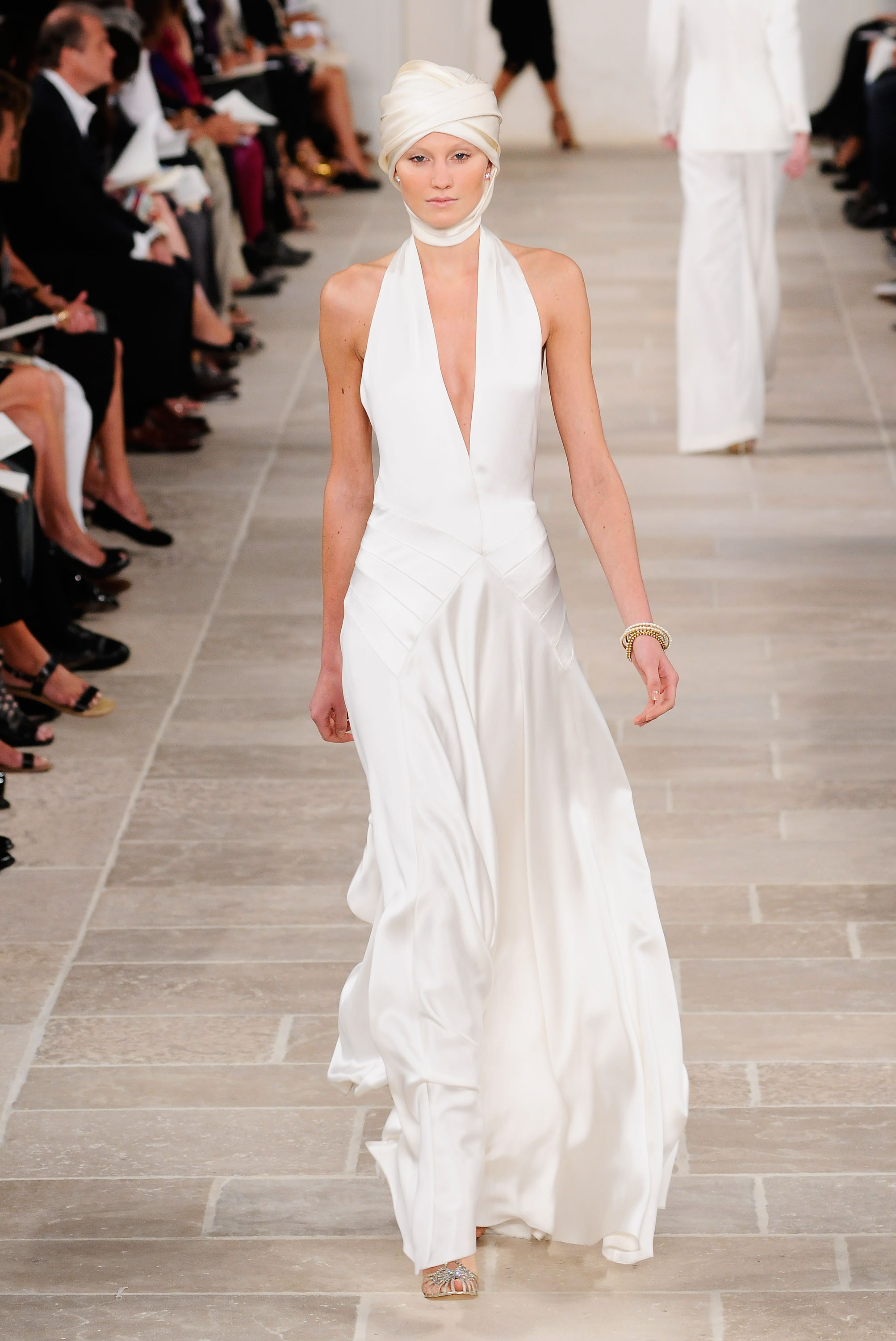 A Ralph Lauren spring/summer 2009 runway model wearing a white gown.