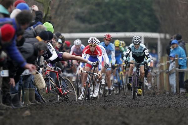 Mitchell Huenders crashes into the barriers on a section of thick mud.