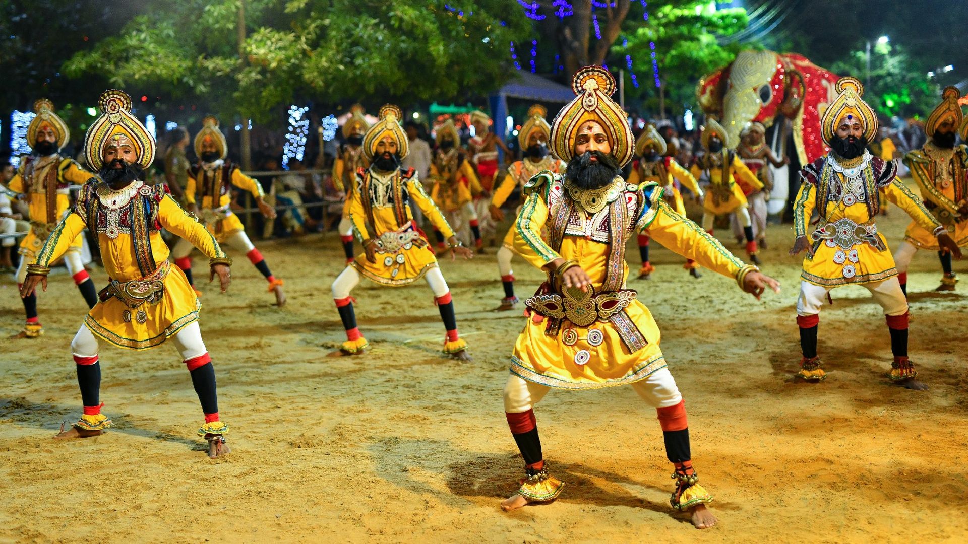 
                                Dancers in traditional costume perform during the annual Kataragama Esala festival in Sri Lanka
                            