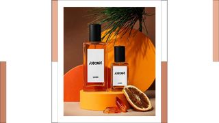 two bottles of Lush Karma perfume on an orange stand
