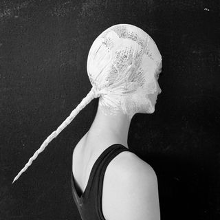 white paper-mache ponytail