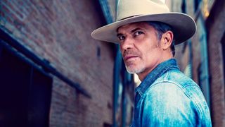 timothy olyphant in a cowboy hat and denim shirt in Justified: City Primeval