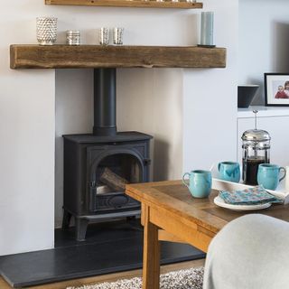 living room with white walls and fireplace