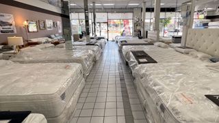 Mattresses are displayed for sale in a mattress store