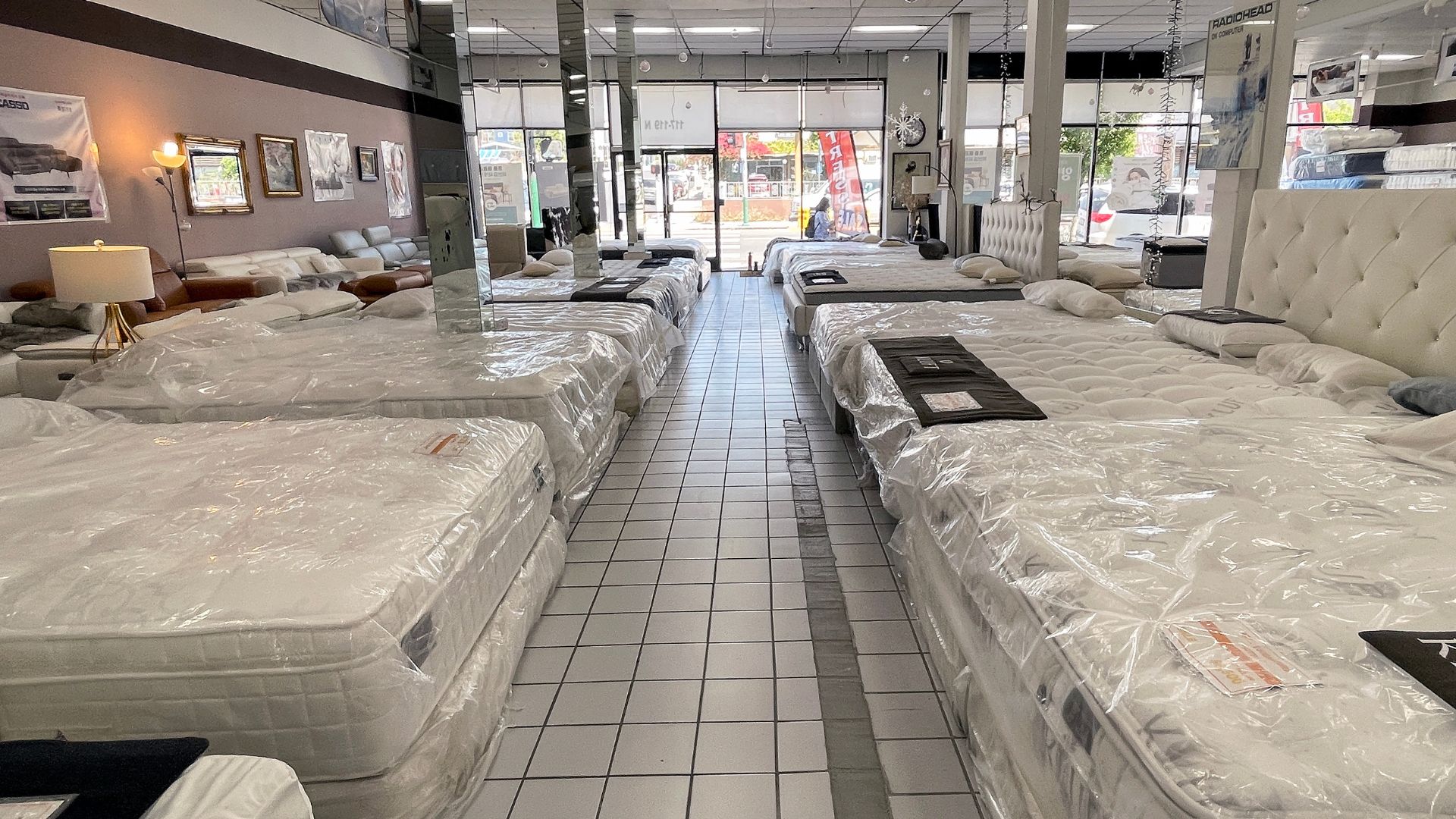 Mattresses are displayed for sale in a mattress store