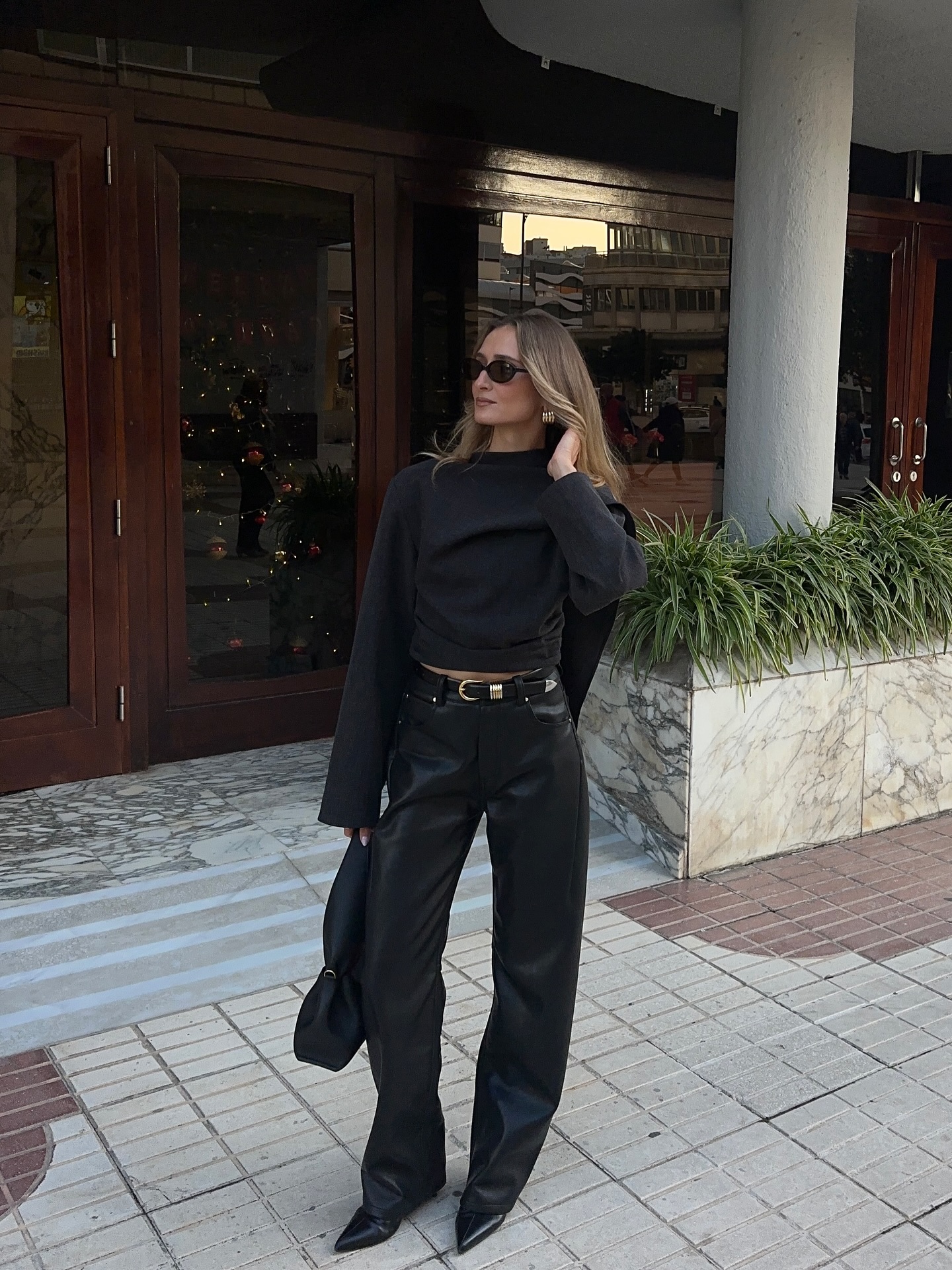 A woman wearing a fall leather-pant outfit in 2026.