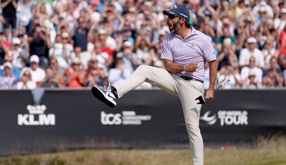 Larrazabal fist pumps and kicks his leg after holing the winning putt