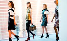 four females models walking at Louis Vuitton's Autumn Winter Show 2014 designs by Nicolas Ghesquière'