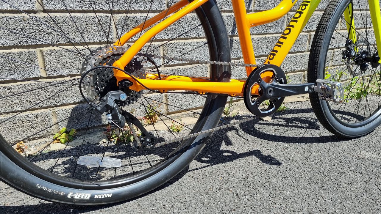 A shot of the full drivetrain on a yellow and orange bike