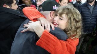Taylor Swift hugging Travis Kelce after Kansas City Chiefs game